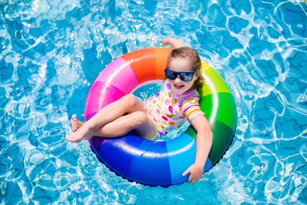 Happy girl in swimming pool