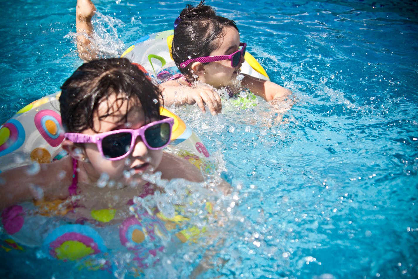 2 Girl's Swimming during Daytime